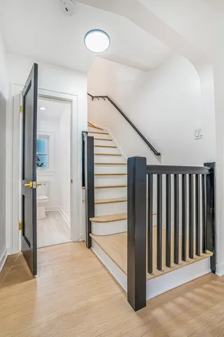 a view of a livingroom with entryway and stairs