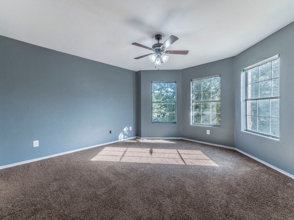 924 Satellite View Round Rock, TX 78665 - Photo 25 of 30 Spare room opposite sid of garage with carpet and ceiling fan