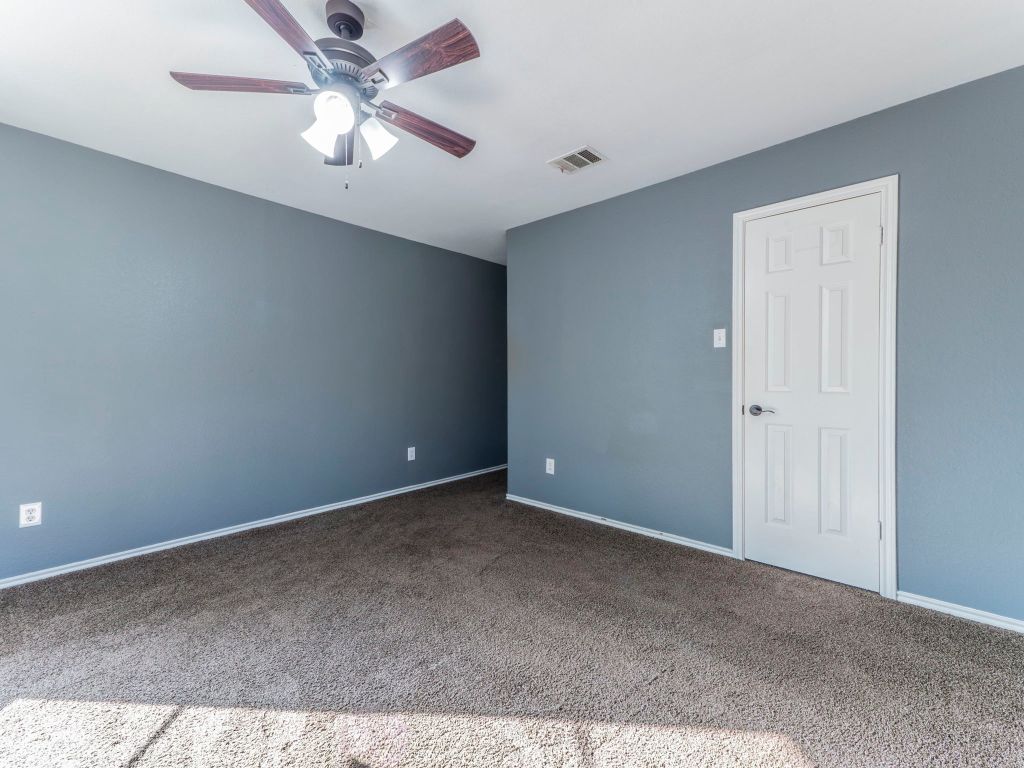 924 Satellite View Round Rock, TX 78665 - Photo 26 of 30 Carpeted empty room featuring ceiling fan and baseboards