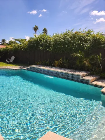 a view of a golf course with a lake