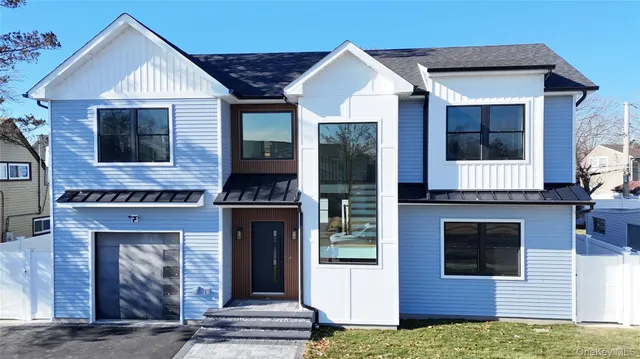 a front view of a house with a garage