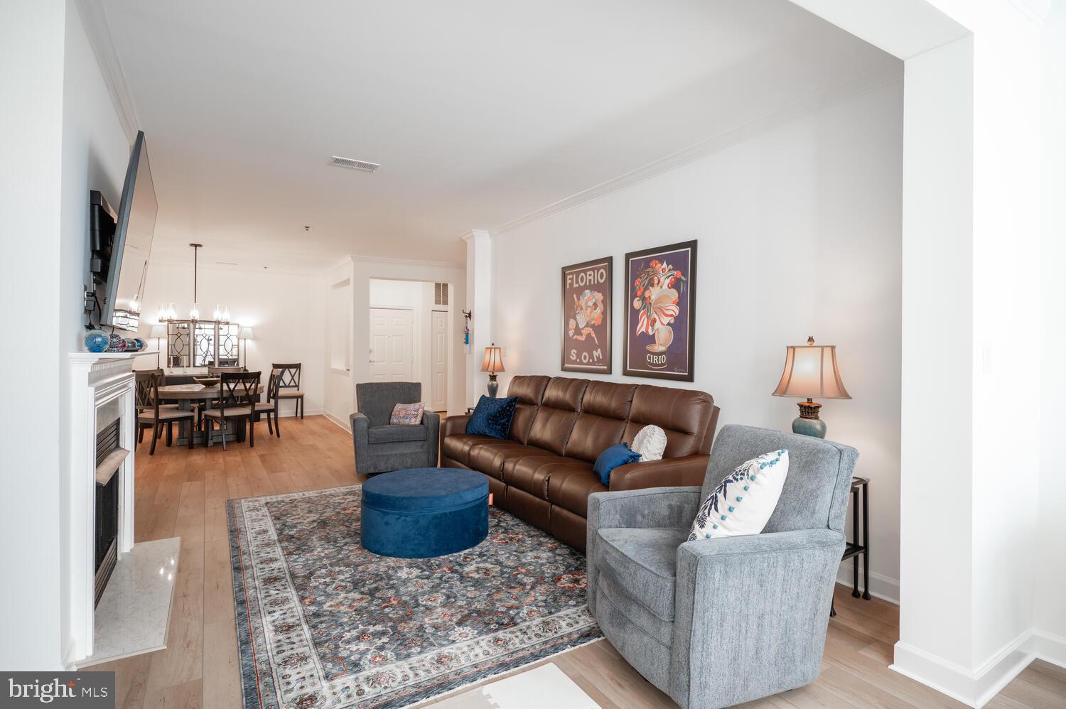 10328 Sager Avenue, Unit 217 Fairfax, VA 22030 - Photo 12 of 42 a living room with furniture and a wooden floor