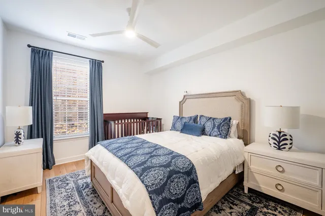 a bedroom with a large bed and a window