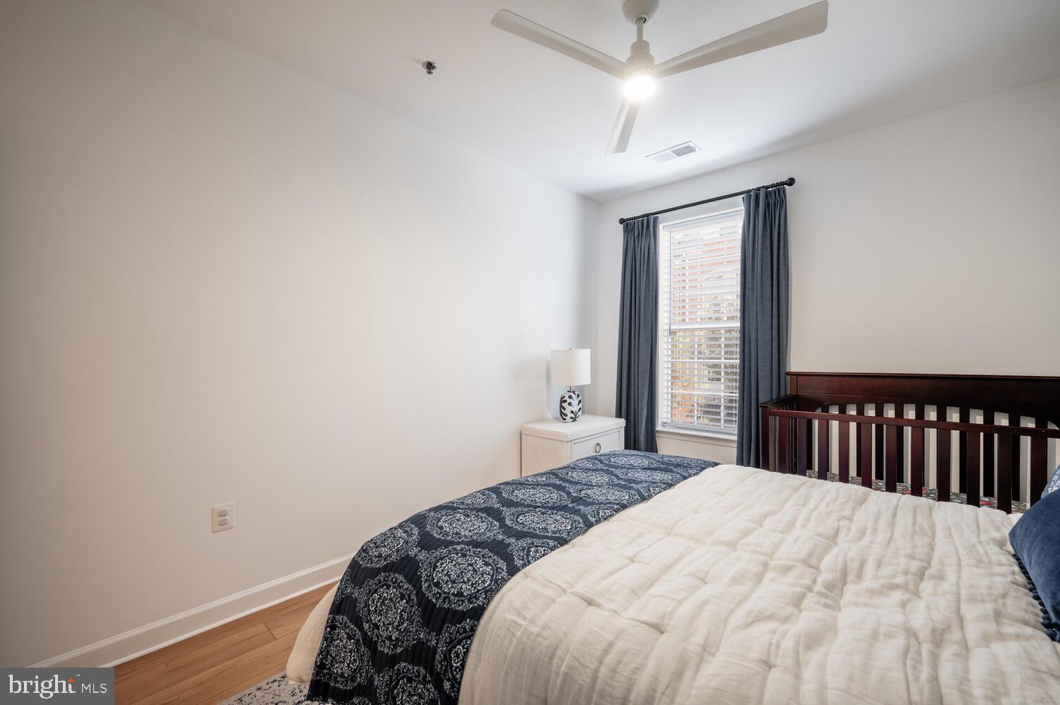 10328 Sager Avenue, Unit 217 Fairfax, VA 22030 - Photo 22 of 42 a bedroom with a bed and a window