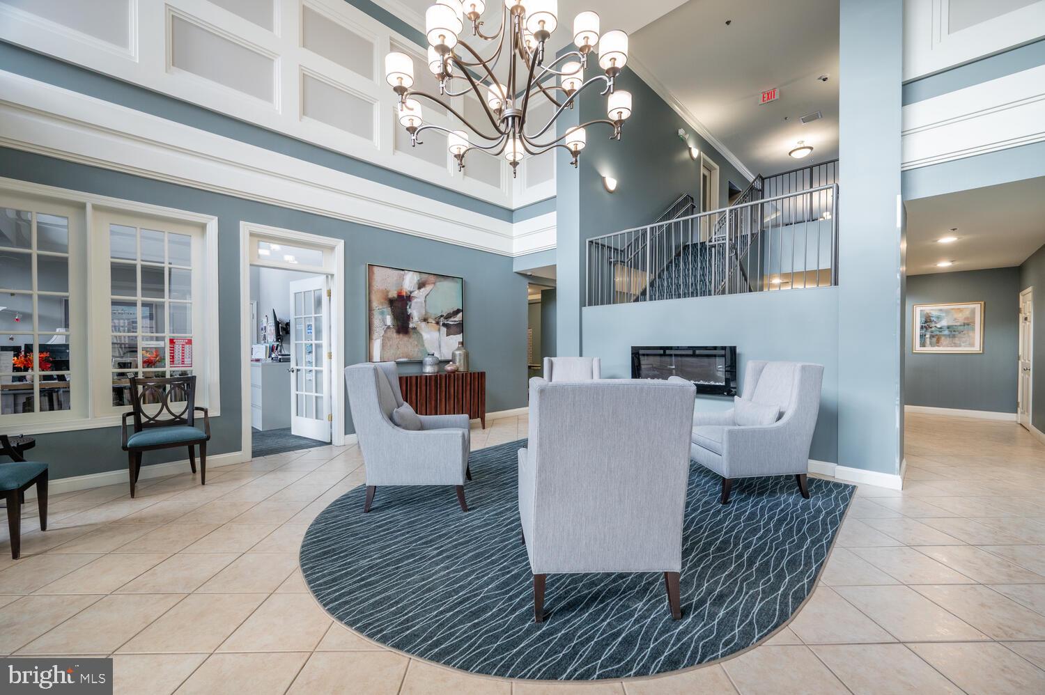 10328 Sager Avenue, Unit 217 Fairfax, VA 22030 - Photo 25 of 42 a living room with furniture and a fireplace