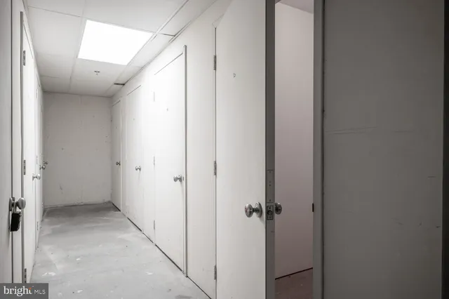 a view of hallway with stainless steel appliances