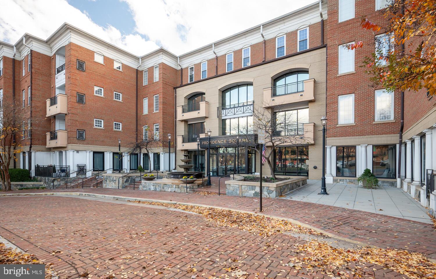 10328 Sager Avenue, Unit 217 Fairfax, VA 22030 - Photo 33 of 42 a street view with tall buildings
