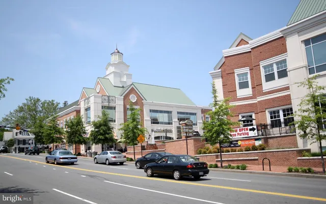 a view of a cars park in front of a building