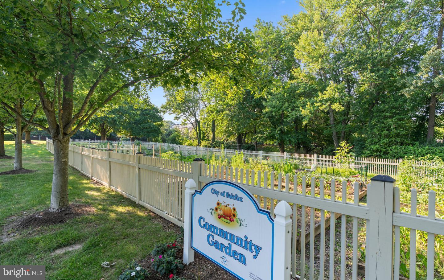 10328 Sager Avenue, Unit 217 Fairfax, VA 22030 - Photo 38 of 42 a view of swimming pool with a deck and a garden