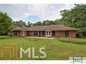 103 St Thomas Drive, Unit 3 Rincon, GA 31326 - Photo 1 of 1 a front view of a house with a garden