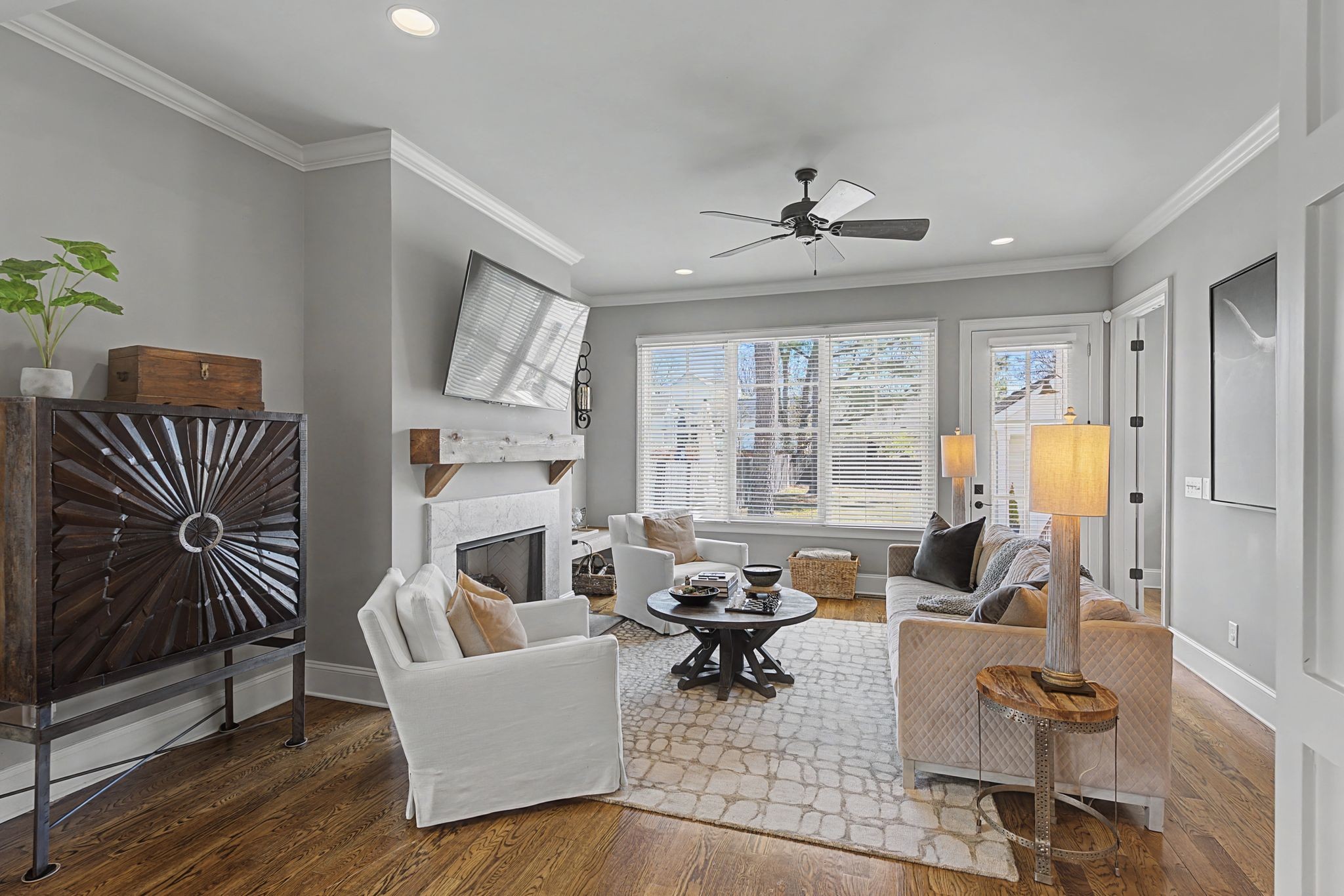 4108 A Lone Oak Road Nashville, TN 37215 - Photo 12 of 36 a living room with furniture a fireplace and a chandelier