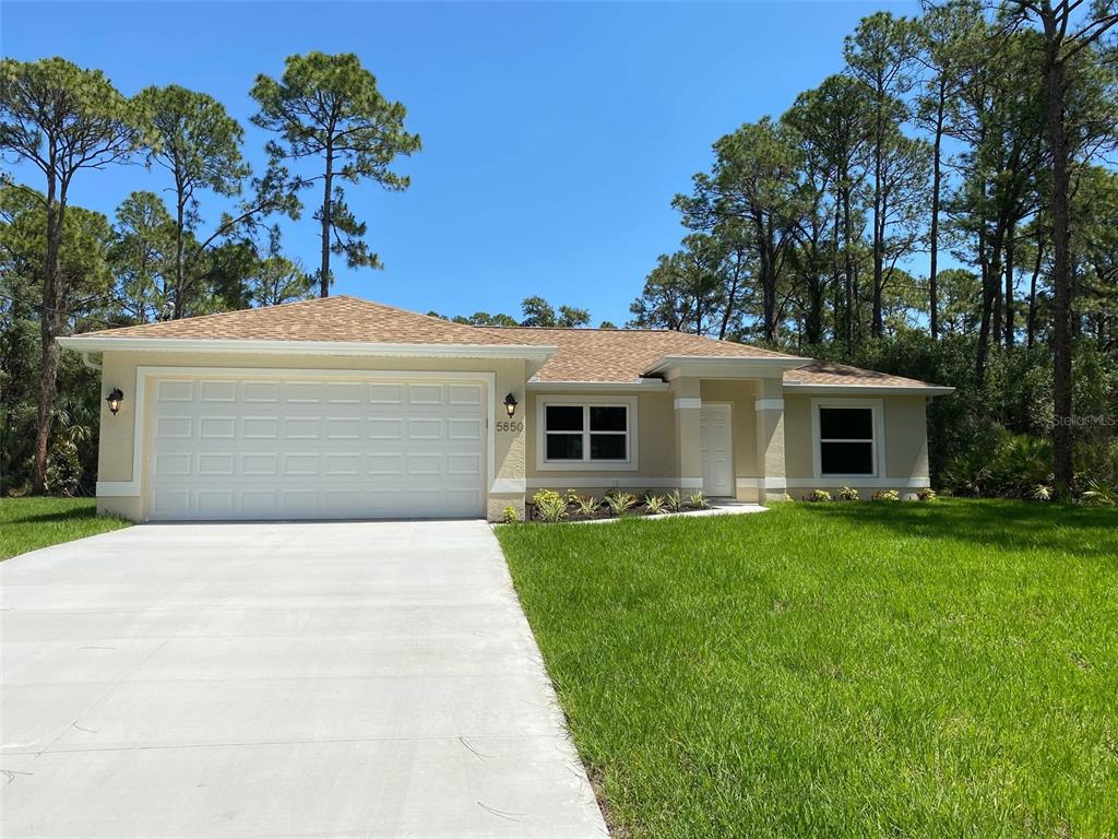 5850 Gagstatter Road North Port, FL 34291 - Photo 1 of 1 a front view of a house with a garden