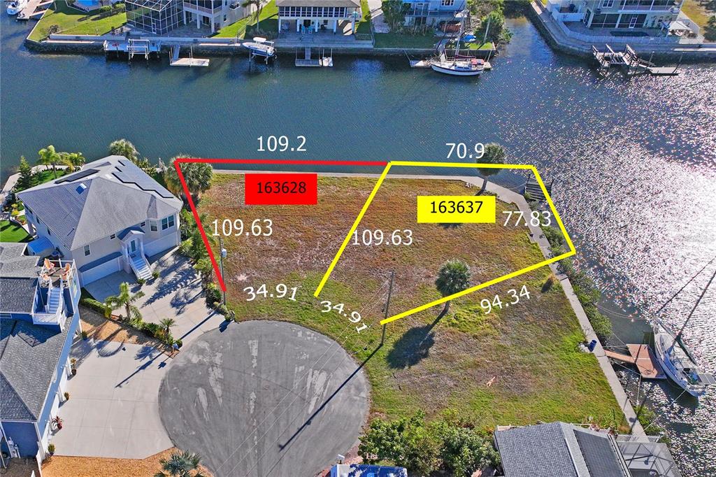 8 6th Isle Drive Hernando Beach, FL 34607 - Photo 3 of 12 an aerial view of a house with a swimming pool
