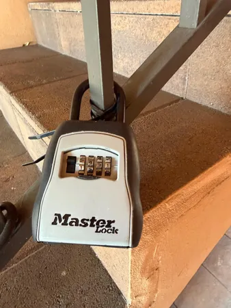 a front view of a house with sign board