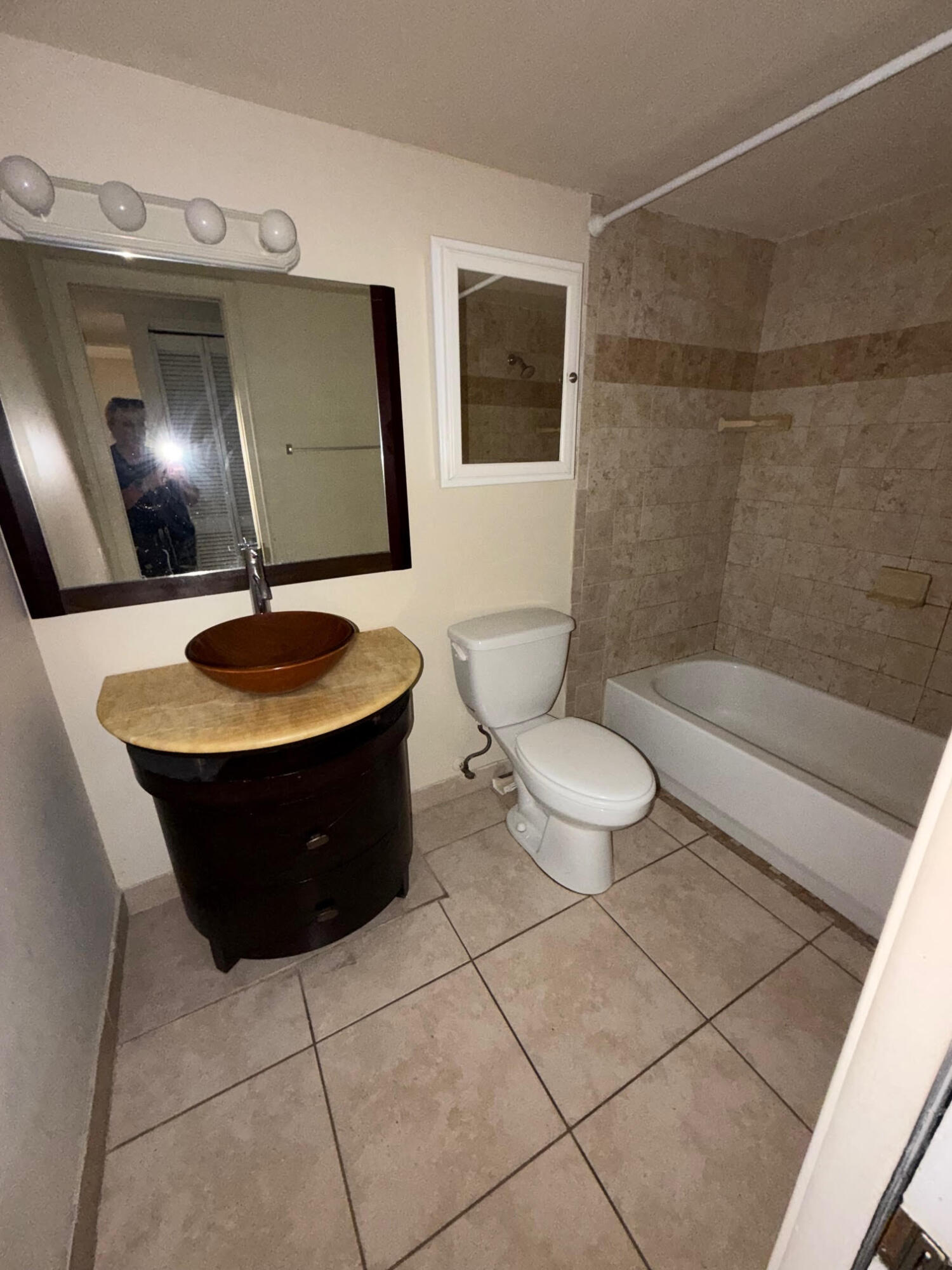 50 Southeast 12th Street, Unit 1520 Boca Raton, FL 33432 - Photo 7 of 14 a bathroom with a toilet sink and mirror