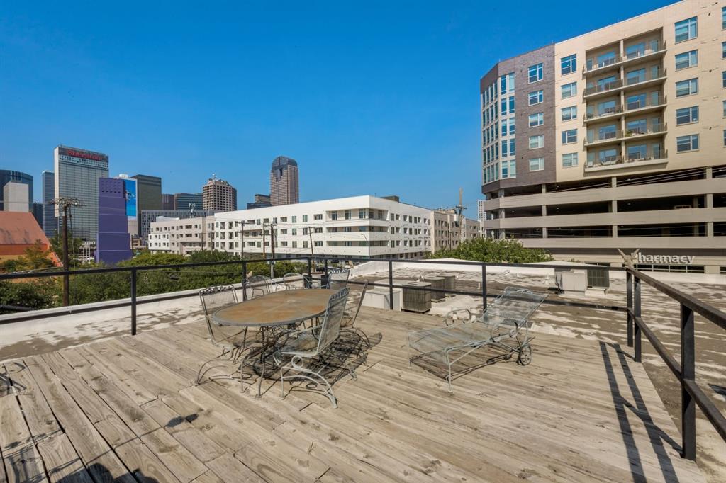 2700 Live Oak Street, Unit 101 Dallas, TX 75204 - Photo 11 of 29 a view of a terrace with wooden benches