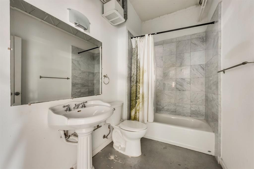 2700 Live Oak Street, Unit 101 Dallas, TX 75204 - Photo 18 of 29 a bathroom with a sink toilet and shower