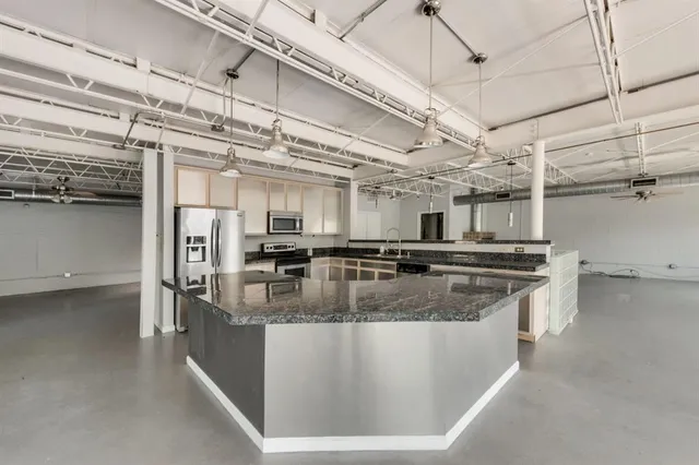 a view of a hallway with wooden floors