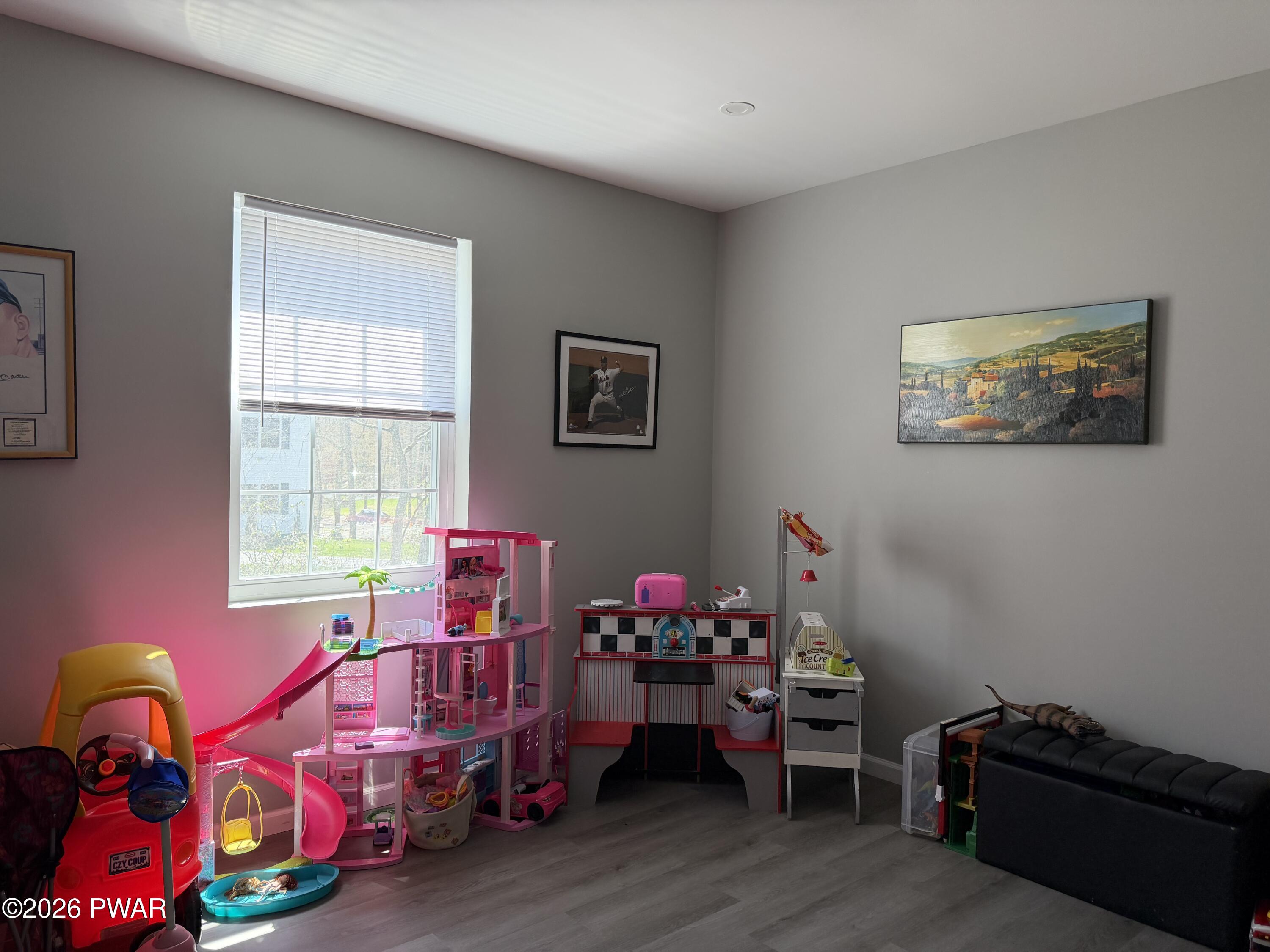 801 Maple Ridge Court Hawley, PA 18428 - Photo 30 of 55 a bedroom with furniture toys and a window