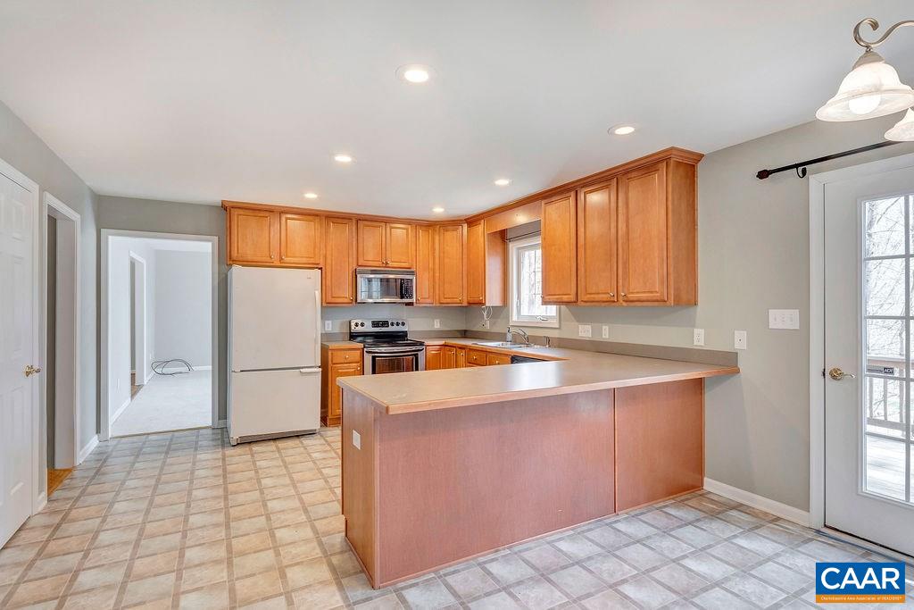 38 Riverside Drive Palmyra, VA 22963 - Photo 11 of 50 a large kitchen with stainless steel appliances a large window and a counter top space