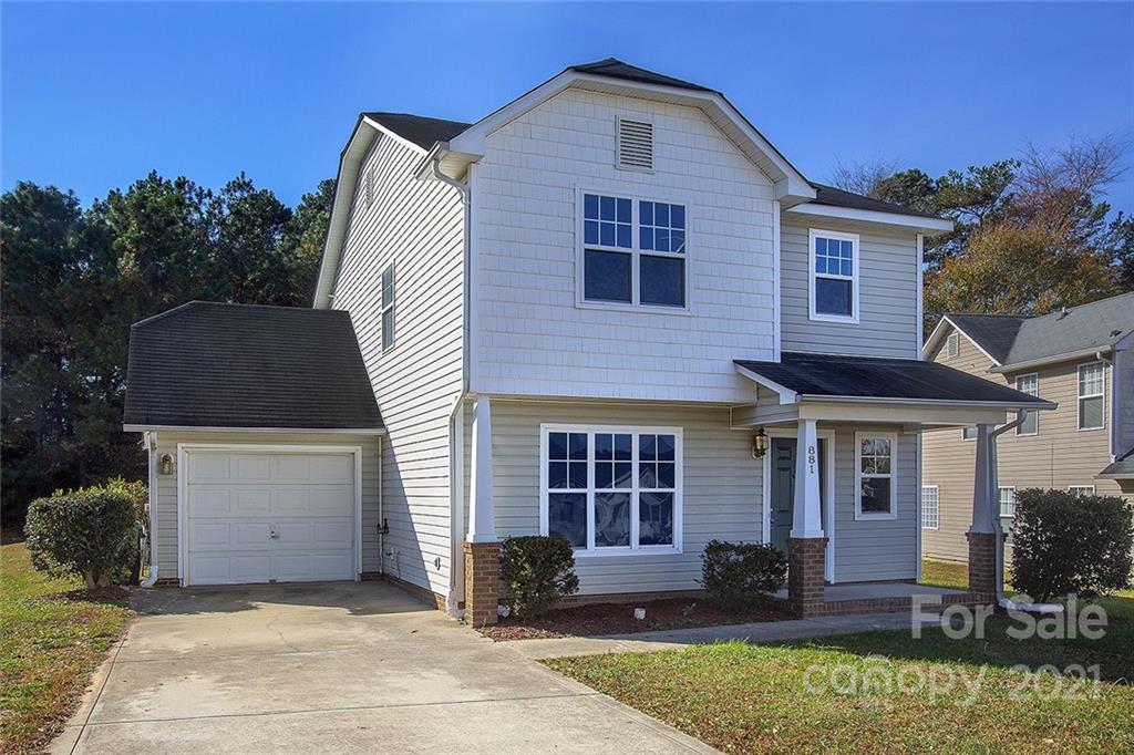 881 Raindrops Road Gastonia, NC 28054 - Photo 1 of 25 a front view of a house with a yard