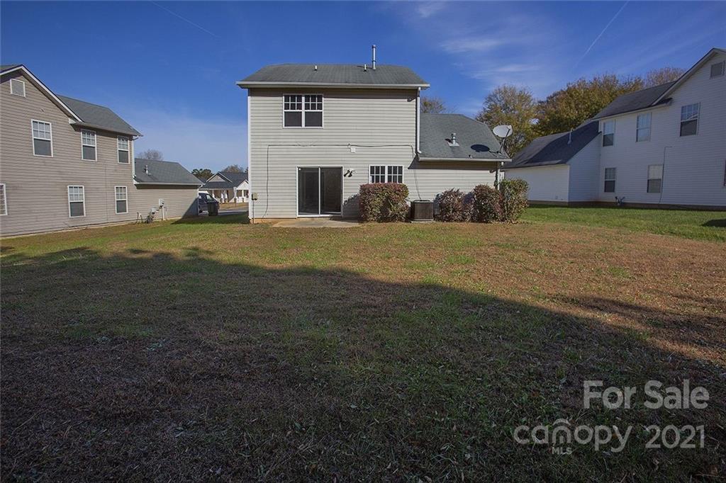 881 Raindrops Road Gastonia, NC 28054 - Photo 3 of 25 a view of a house with backyard and a tree