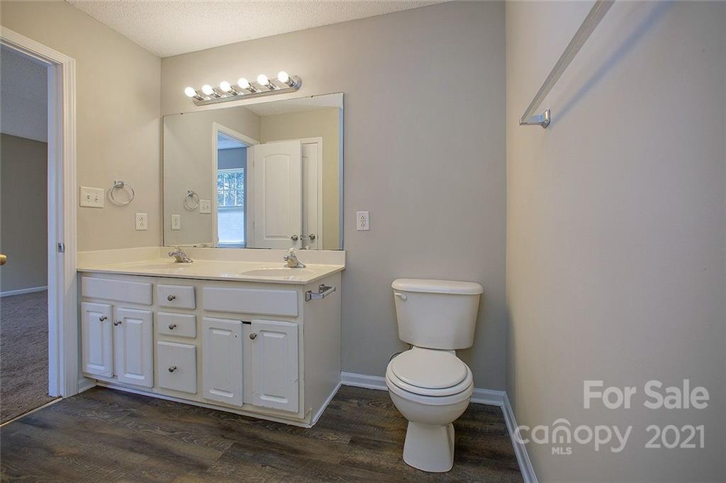 881 Raindrops Road Gastonia, NC 28054 - Photo 24 of 25 a bathroom with a toilet sink and mirror