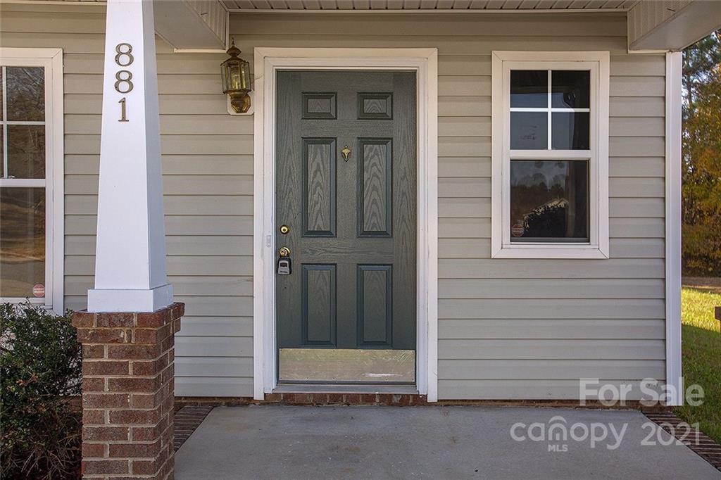 881 Raindrops Road Gastonia, NC 28054 - Photo 5 of 25 a view of front door of house and window
