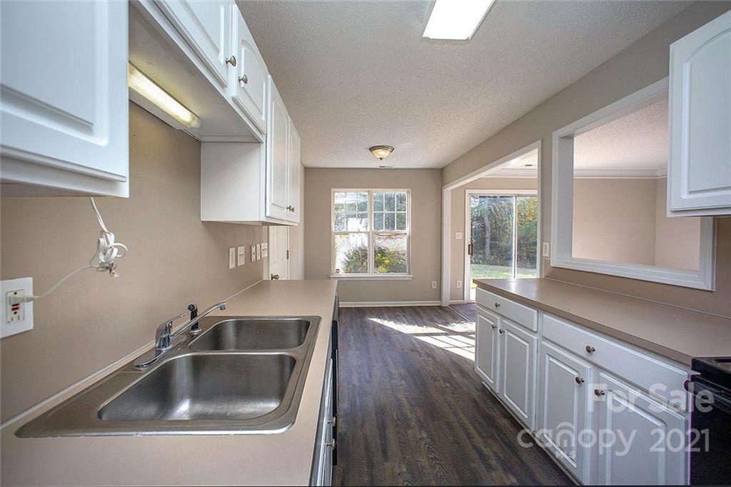 881 Raindrops Road Gastonia, NC 28054 - Photo 6 of 25 a kitchen with sink and window
