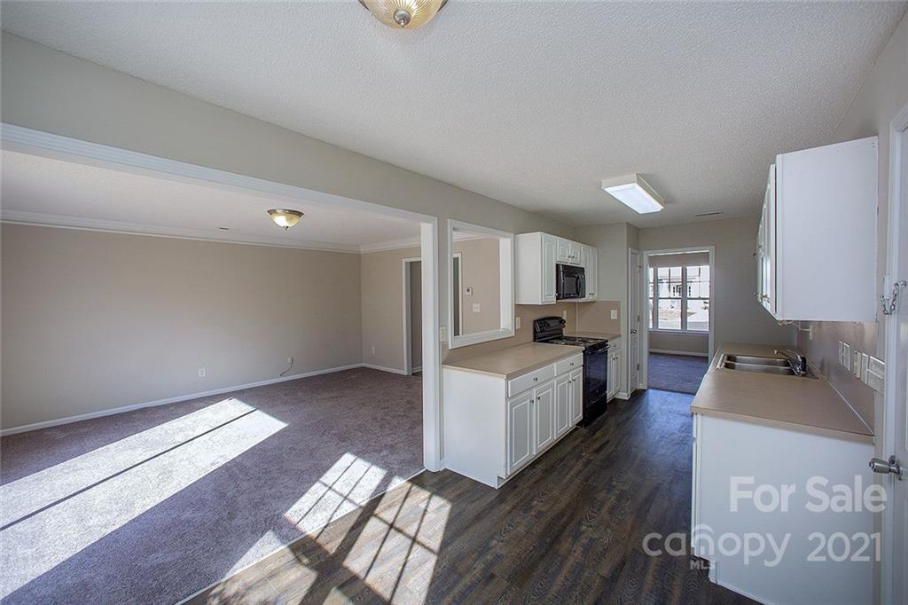 881 Raindrops Road Gastonia, NC 28054 - Photo 7 of 25 a living room with furniture and a flat screen tv