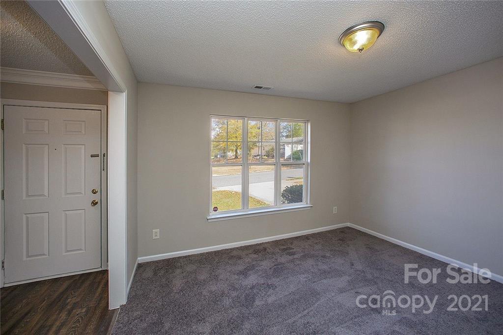 881 Raindrops Road Gastonia, NC 28054 - Photo 8 of 25 an empty room with windows