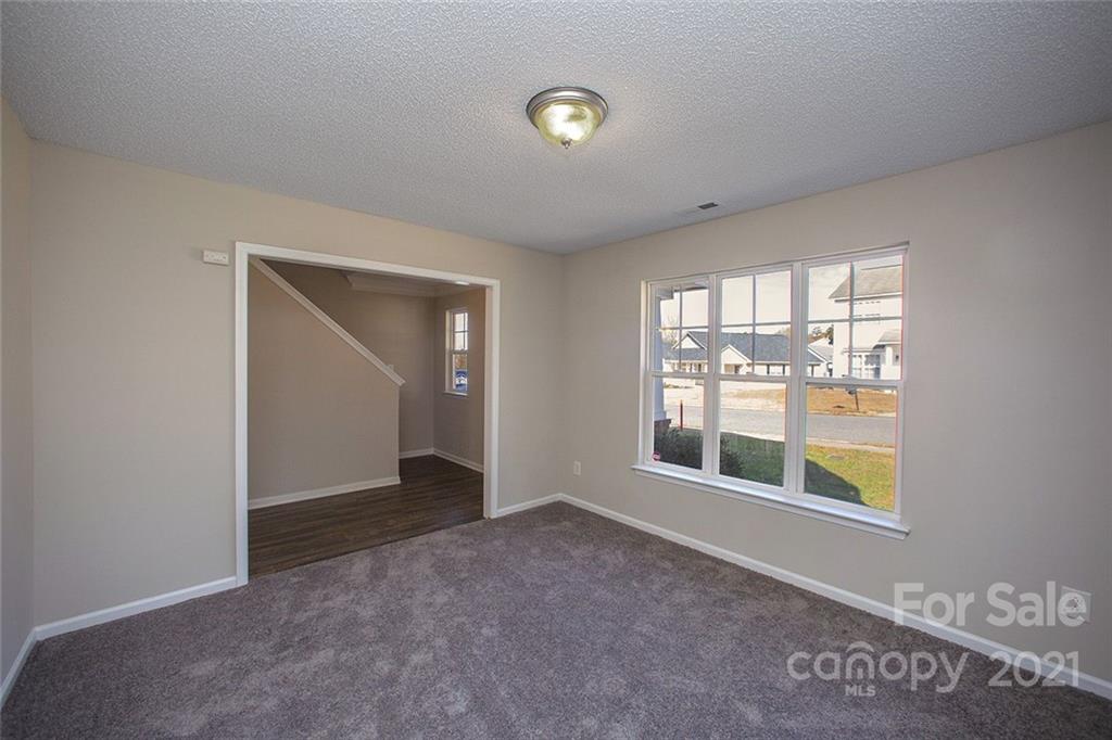 881 Raindrops Road Gastonia, NC 28054 - Photo 9 of 25 a view of an empty room with a window