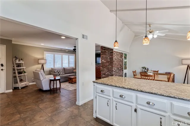 a kitchen with stainless steel appliances a refrigerator sink and cabinets