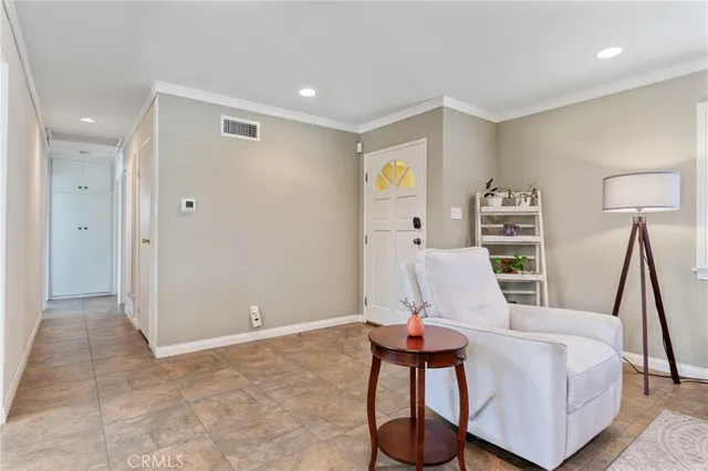 a bedroom with a large bed and a flat screen tv
