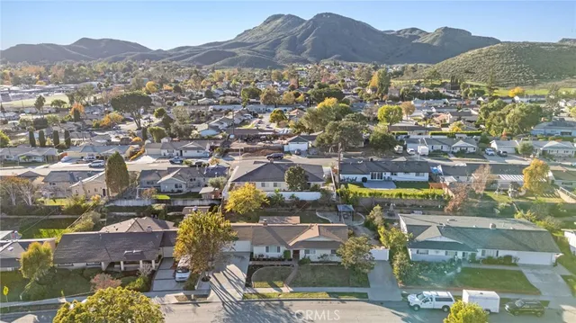 a view of a house with backyard and porch