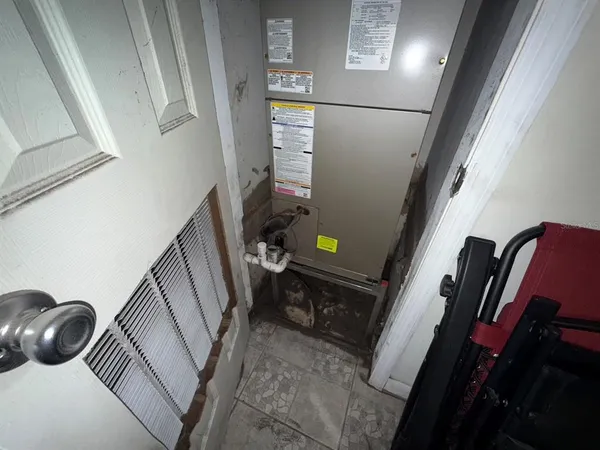 a utility room with sink dryer and washer