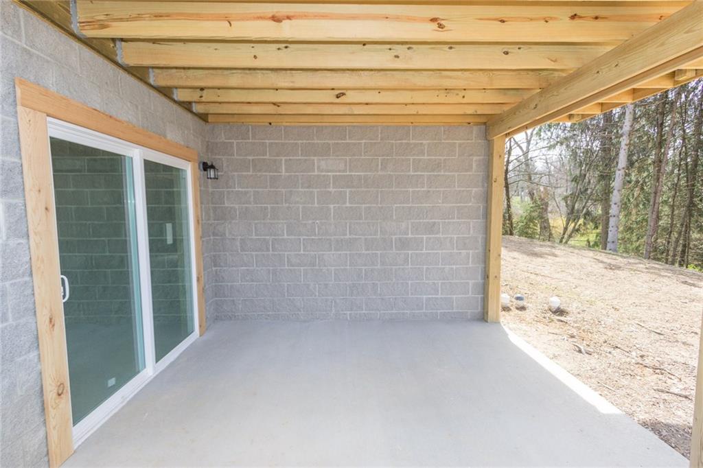 155 Spring Hill Road Aliquippa, PA 15001 - Photo 16 of 18 Looking for some privacy? Large covered cement patio, from the lower level will give you that!