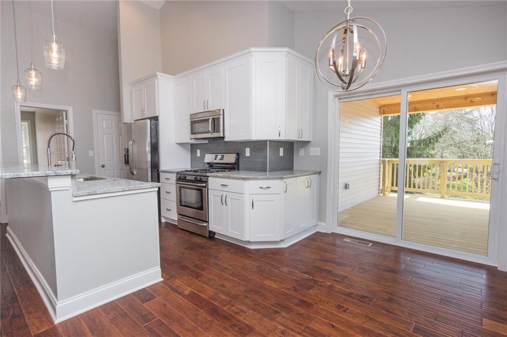 155 Spring Hill Road Aliquippa, PA 15001 - Photo 6 of 18 Room at the breakfast bar for 5/6 or use the dining area with a view out back!