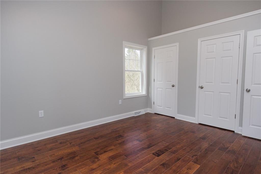 155 Spring Hill Road Aliquippa, PA 15001 - Photo 9 of 18 Master bedroom with two large closets, and a full bath, cathedral ceilings, and ceiling fan.