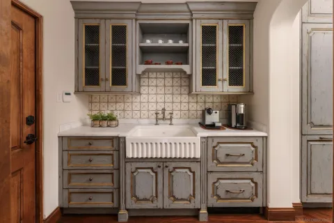 a kitchen with a sink and cabinets