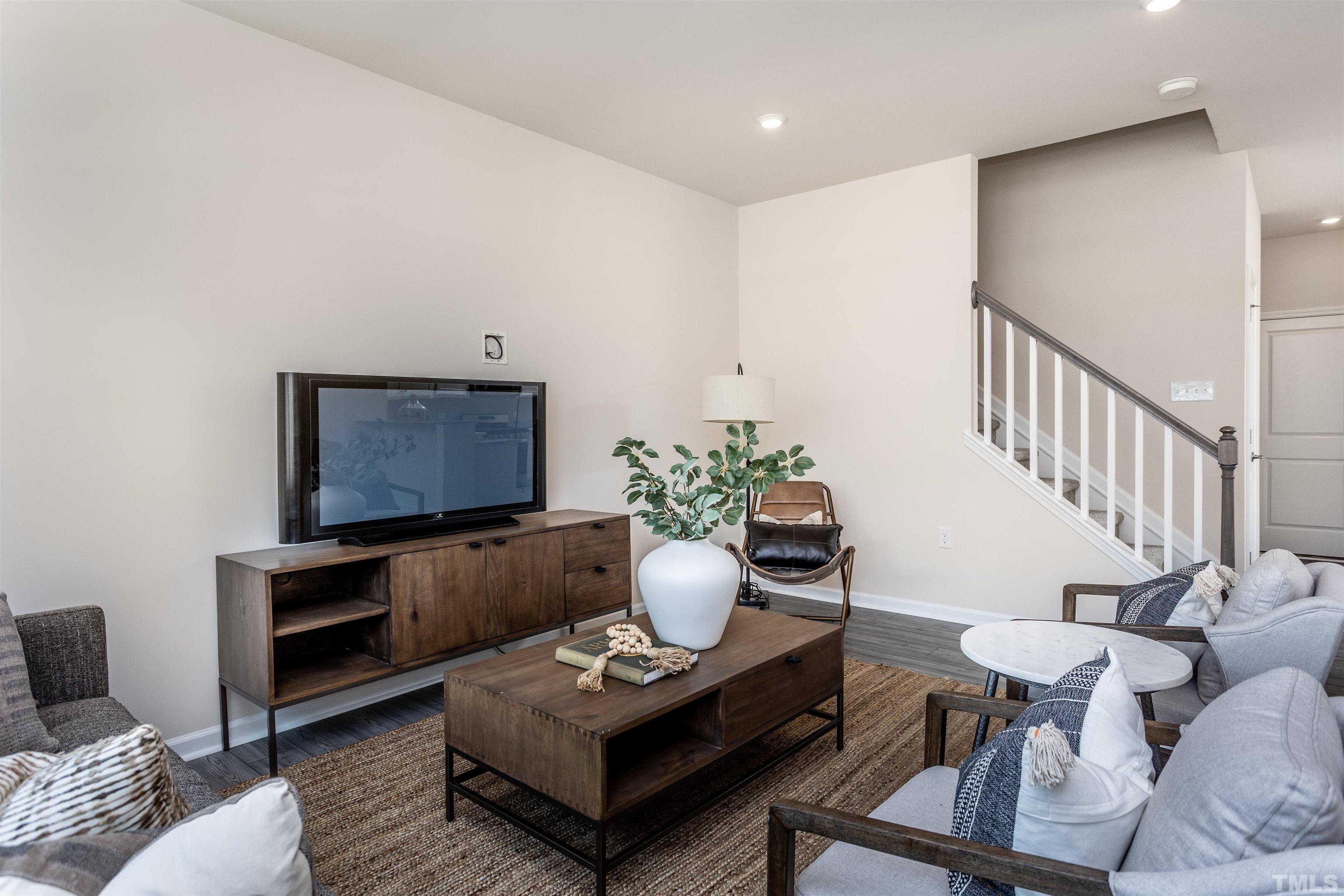 4902 Megara Run, Unit ROYAL Raleigh, NC 27603 - Photo 5 of 23 a living room with furniture and a potted plant
