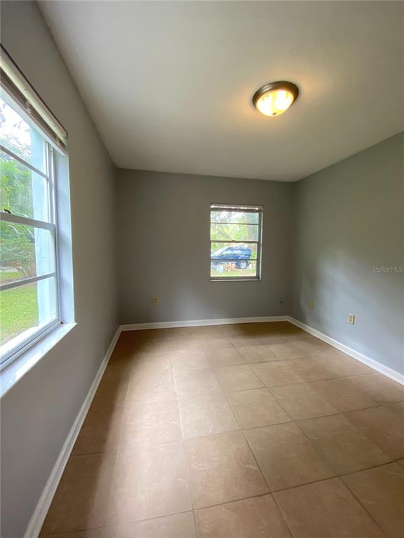 253 Northwest 3rd Street Micanopy, FL 32667 - Photo 9 of 22 a view of an empty room and a window