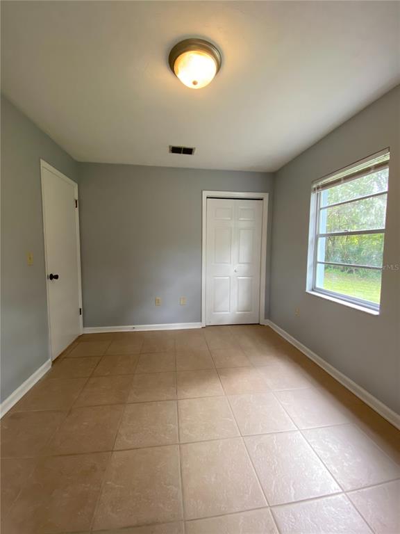 253 Northwest 3rd Street Micanopy, FL 32667 - Photo 10 of 22 a view of an empty room with a window