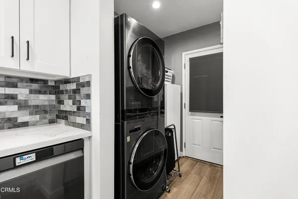 a view of a storage and utility room with washer and dryer