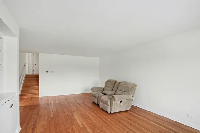 a room with wooden floor and chair