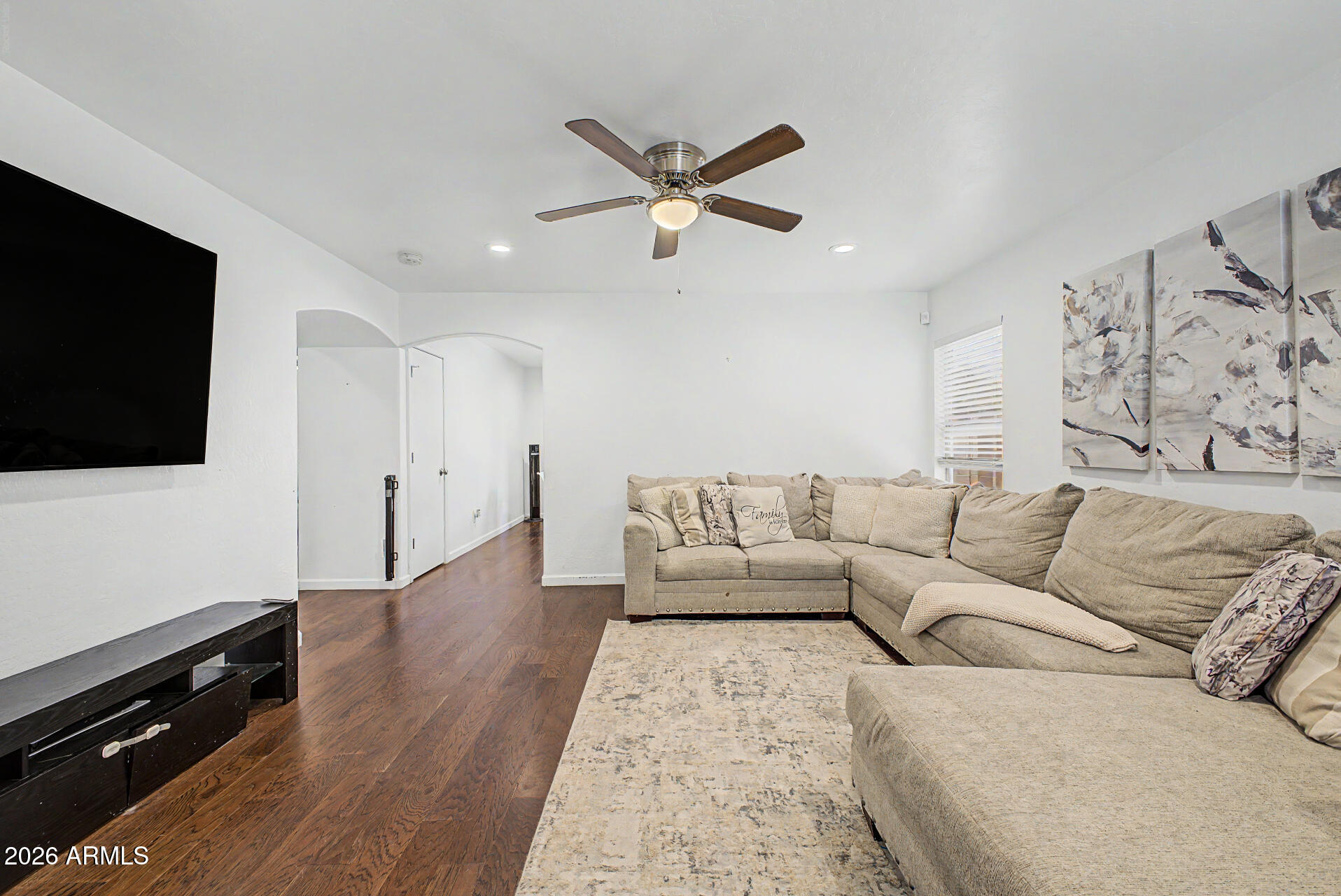 12008 West Larkspur Road El Mirage, AZ 85335 - Photo 4 of 25 a living room with furniture and a flat screen tv