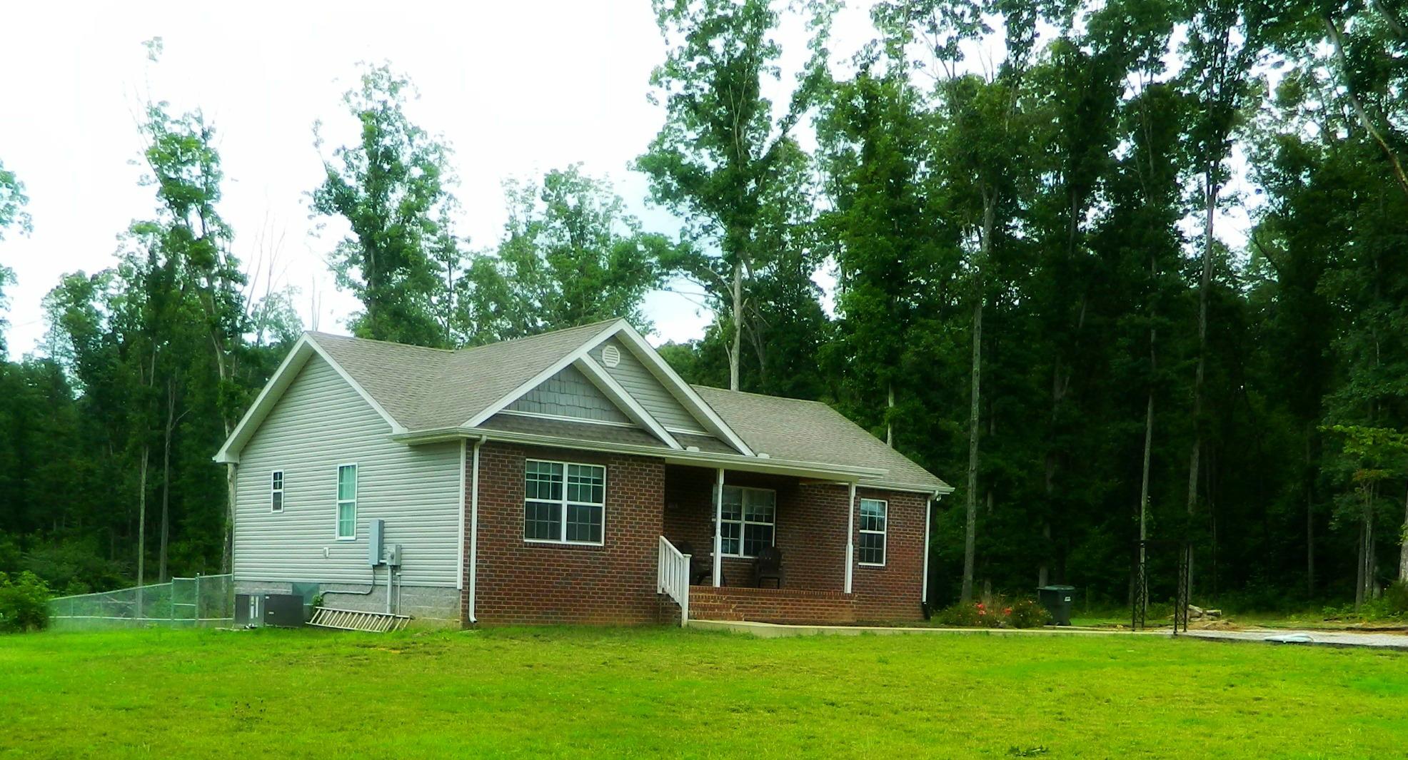 430 Kaiser Road Dickson, TN 37055 - Photo 2 of 13 a front view of a house with garden