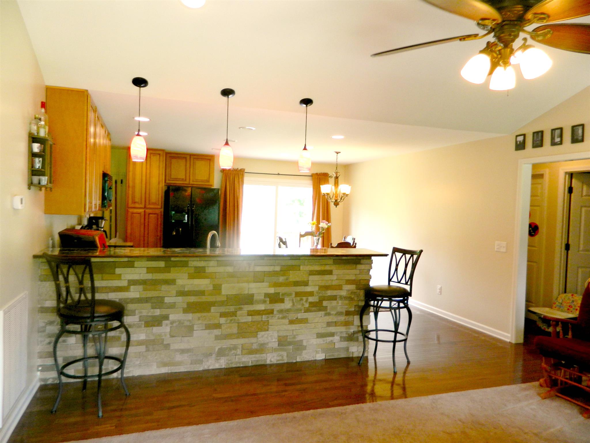 430 Kaiser Road Dickson, TN 37055 - Photo 5 of 13 a view of a dining room with furniture a chandelier and wooden floor