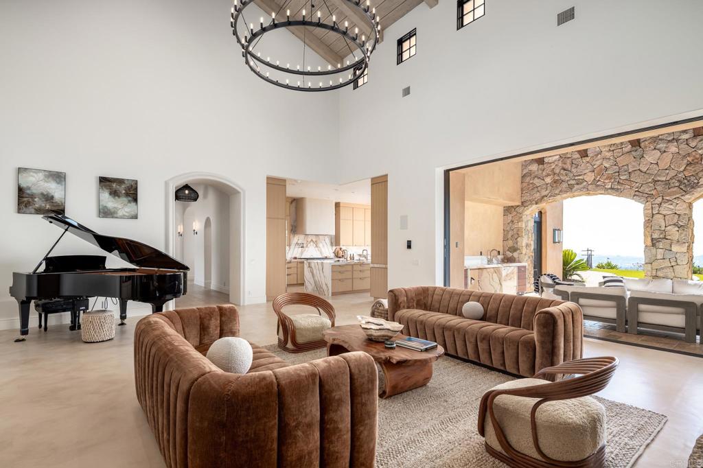 18000 Sunset Point Road Poway, CA 92064 - Photo 8 of 36 a living room with furniture and a large window