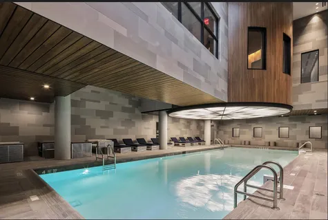a view of a swimming pool with outdoor seating